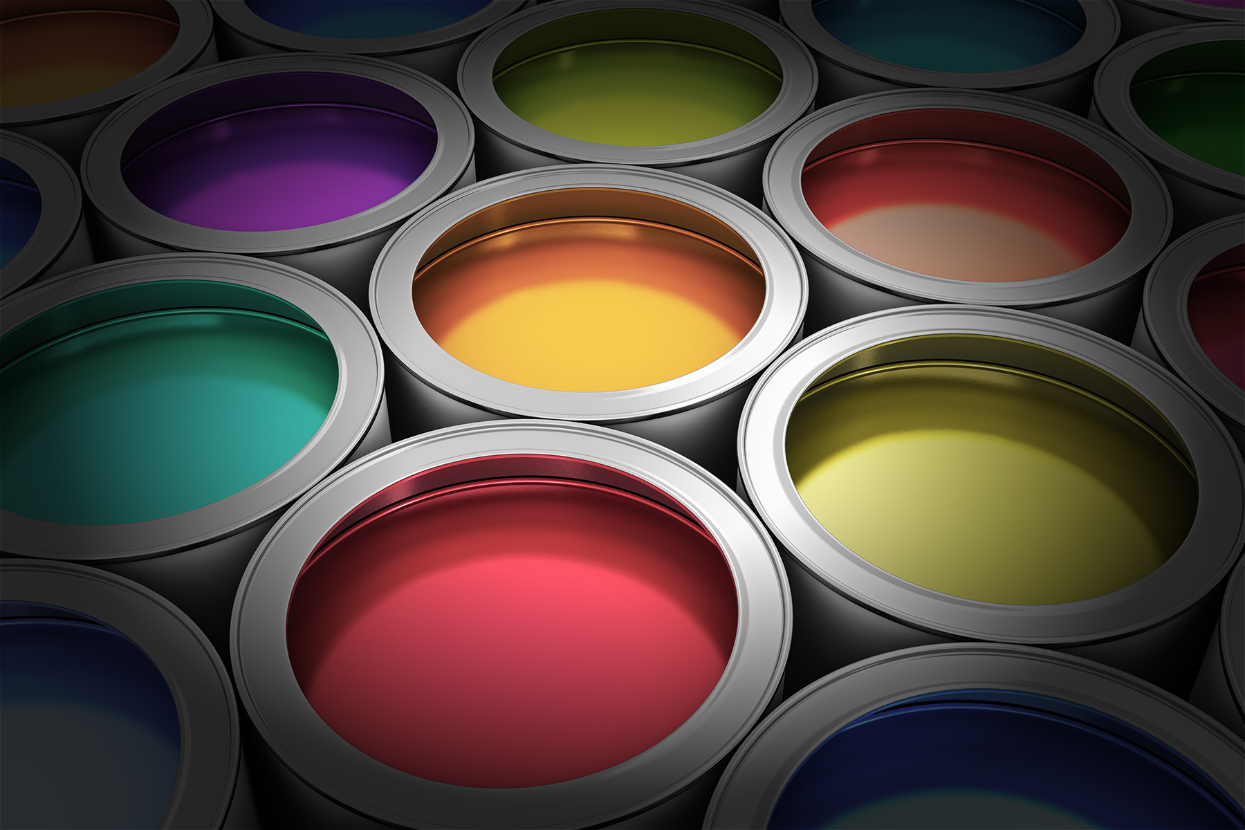 Open paint cans filled with vibrant colored resin coatings